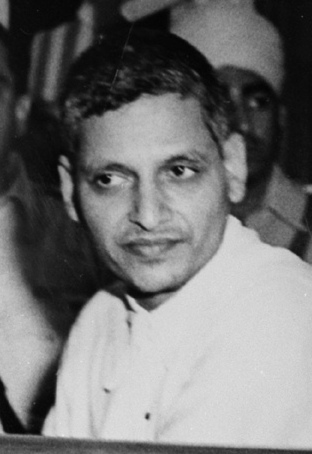 The triale of persons accused of participation and complicity in Mahatma Gandhi's  assassination opened in the Special Court in Red Fort Delhi on May 27, 1948. A Close up of the accused persons. Left to right front row: Nathuram Vinayak Godse, Narayan Dattatraya Apte and Vishnu Ramkrishna Karkar. Seated behind are (from left to right) Diganber Ram Chandra Badge, Shankar s/o Kistayya, Vinayak Damodar Savarkar, Gopal Vinayak Godse and Dattatrays Sadashiv Parachure.